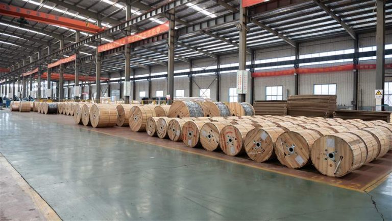 Finished conductor drums lined up in the despatch warehouse